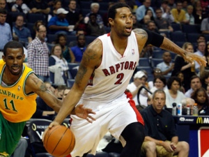 Memphis Grizzlies guard Mike Conley (11) goes for the ball as Toronto Raptors forward James Johnson (2) heads to the hoop in the first half of an NBA basketball game on Friday, March 16, 2012, in Memphis, Tenn. (AP Photo/Alan Spearman)