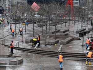 A closed Zuccotti Park is cleaned in New York, Sunday, March 18, 2012. Dozens of police officers cleared the park late Saturday and early Sunday where the Occupy movement was born six months ago and made several arrests after hundreds of protesters returned in an anniversary observance and defiantly resisted calls to clear out. (AP Photo/Seth Wenig)