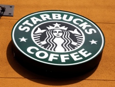 This Jan. 3, 2012, file photo shows the Starbucks Coffee logo in Mountain View, Calif. (AP Photo/Paul Sakuma, File)