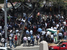 Workers and resident gather at the Angel de la Independencia square after evacuating buildings during a earthquake felt in Mexico City on Tuesday, March 20, 2012. A strong, long earthquake with epicenter in Guerrero state shook central southern Mexico on Tuesday, swaying buildings in Mexico City and sending frightened workers and residents into the streets. (AP Photo/Dario Lopez-Mills)