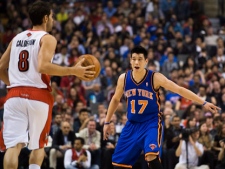 Jeremy Lin of the New York Knicks covers Jose Calderon of the Toronto Raptors during NBA action in Toronto on Friday, March 23 2012. (THE CANADIAN PRESS/Aaron Vincent Elkaim)