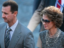 In this Monday, July 14, 2008 file photo, Syrian President Bashar Assad arrives with his wife Asma for the Bastille day ceremonies in Paris. (AP Photo/Michel Spingler)