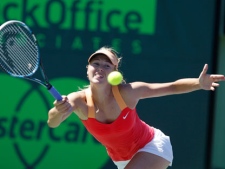 Maria Sharapova, of Russia, returns the ball to Ekaterina Makarova, of Russia, during the Sony Ericsson Open tennis tournament on Monday, March 26, 2012, in Key Biscayne, Fla. (AP Photo/Lynne Sladky)