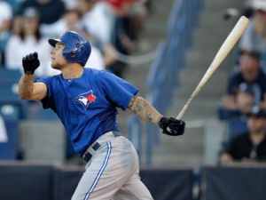 Toronto Blue Jays' Brett Lawrie follows through on a second-inning triple during a spring training baseball game against the New York Yankees in Tampa, Fla., Tuesday, March 27, 2012. (AP Photo/Kathy Willens)