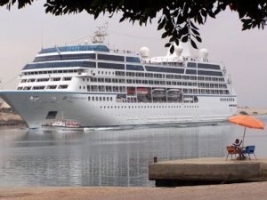 The Maltese registered cruise ship , Azamara Quest, sails through the Suez canal, Egypt, in this April 30, 2010 file photo from the Red sea towards the Mediterranean sea on its way to Athens. The fire on the Azamara Quest started late Friday, March 30, 2012 a day after the ship left Manila for Sandakan, Malaysia, and was immediately put out, said coast guard spokesman Lt. Cmdr. Algier Ricafrente. Five crew members were injured. (AP Photo/File)