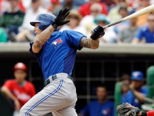 Toronto Blue Jays' Brett Lawrie follows through on a second-inning, RBI single during the Blue Jays' 8-5 victory over the Philadelphia Phillies in their spring training baseball game in Clearwater, Fla., Saturday, March 31, 2012. (AP Photo/Kathy Willens)