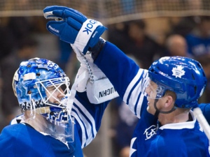 Toronto Maple Leafs goalie Ben Scivens, left, celebrates his win with teammate Joey Crabb, right,after defeating the Buffalo Sabres during third period NHL hockey action in Toronto on Saturday, March 31, 2012. THE CANADIAN PRESS/Nathan Denette