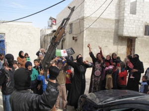 In this Sunday, April 1, 2012, photo, Syrians chant slogans against President Bashar Assad upon the arrival of the Free Syrian Army in a neighborhood of Damascus, Syria.  (AP Photo) 