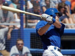 Toronto Blue Jays pinch-hitter Robbie Schimpf hits a fifth-inning grand slam during the Blue Jays' 13-8 victory over the Detroit Tigers in a spring training baseball game in Dunedin, Fla. on Tuesday, April 3, 2012. (AP Photo/Kathy Willens)