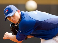 Toronto Blue Jays starting pitcher Brett Cecil takes his warmup pitches prior to Spring Training action against the Pittsburgh Pirates in Dunedin, Fla. on Saturday, March 3 2012. (THE CANADIAN PRESS/Frank Gunn)