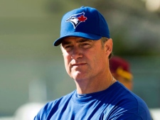 Toronto Blue Jays manager John Farrell keeps an eye on the action in Dunedin, Fla. on Monday, February 20, 2012. Farrell had to handle a significant learning curve in his first year as a big-league manager after four seasons as a pitching coach with the Boston Red Sox. THE CANADIAN PRESS/Frank Gunn