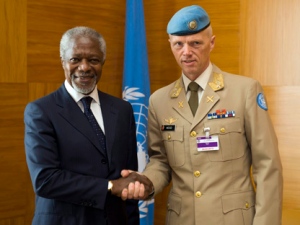 The Joint Special Envoy for Syria, Kofi Annan, left, shakes hands with Major-General Robert Mood, right, of Norway before a meeting at the European headquarters of the United Nations in Geneva, Switzerland, Wednesday, April 4, 2012. Mood will head the planning team that is expected to arrive in Damascus to discuss the modalities of the eventual deployment of a U.N. supervision and monitoring mission. (AP Photo/Keystone/Martial Trezzini)