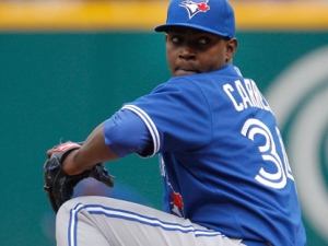 Toronto Blue Jays starting pitcher Joel Carreno throws to the Cleveland Indians in the first inning of a baseball game in Cleveland on Sunday, April 8, 2012. (AP Photo/Amy Sancetta)