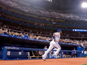 Toronto Blue Jays Jose Bautista takes to the pitch as he is introduced to a sellout crowd ahead of their home opener against the Boston Red Sox in MLB baseball action in Toronto on Monday, April 9, 2012. (THE CANADIAN PRESS/Chris Young)