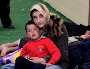 In this photo taken Monday, April 9, 2012, Syrian refugees are seen at a camp in Reyhanli, Turkey. Turkey's prime minister accused Syria of infringing its border and said Tuesday that his country is considering what steps to take in response, including measures "we don't want to think about." (AP Photo/Germano Assad)