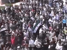 n this image made from amateur video released by the Shaam News Network and accessed Thursday, April 12, 2012, purports to show Syrians chanting slogans during a demonstration in Idlib, Syria. Syrian forces halted attacks on opposition strongholds Thursday in line with a U.N.-brokered truce but the regime defied demands by international envoy Kofi Annan to pull troops back to their barracks, activists said. (AP Photo/Shaam News Network via AP video)