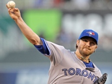 Toronto Blue Jays starting pitcher Kyle Drabek throws during the first inning of a baseball game against the Kansas City Royals on Friday, April 20, 2012, in Kansas City, Mo. (AP Photo/Charlie Riedel)