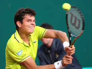 Milos Raonic returns the ball to Albert Montanes during their match at the Monte Carlo Tennis Masters tournament in Monaco on Monday, April 16, 2012. (AP Photo/Claude Paris)