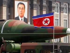 In this photo taken Sunday, April 15, 2012, what appears to be a new missile is carried during a mass military parade at the Kim Il Sung Square in Pyongyang, North Korea, to celebrate the 100th anniversary of the country's founding father Kim Il Sung. The photo shows the warhead's surface is undulated, suggesting it's a thin metal sheet unable to withstand flight pressure, analysts say. Adding more doubt to North Korea's claims of military prowess after its flamboyant rocket launch failure, analysts say the half dozen missiles showcased at the military parade were low-quality fakes. (AP Photo/Ng Han Guan)