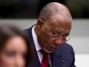 Former Liberian president Charles Taylor looks down in the courtroom of the Special Court for Sierra Leone in Leidschendam, near The Hague, Netherlands, on Thursday, April 26, 2012. Taylor was convicted of aiding and abetting war crimes and crimes against humanity for supporting notoriously brutal Sierra Leone rebels in return for blood diamonds. (AP Photo/Peter Dejong, Pool)