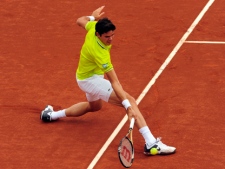 Canadian Milos Raonic returns the ball to Andy Murray during the Barcelona Open tennis tournament in Barcelona, Spain, Friday, April 27, 2012. Raonic won 6-4, 7-6. (AP Photo/Manu Fernandez)