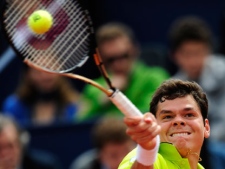 Milos Raonic of Canada returns the ball to David Ferrer of Spain during their semifinal match in the Barcelona open tennis in Barcelona, Spain, Saturday, April 28, 2012. Ferrer won 7-6, 7-6. (AP Photo/Manu Fernandez)