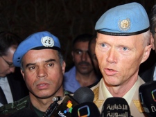 Norwegian Maj. Gen. Robert Mood, head of the U.N. observer team in Syria, right, speaks to reporters after his arrival in Damascus, Sunday, April 29, 2012, as Col. Ahmed Himmiche, left, looks on. Under the peace plan, the U.N. is to deploy as many as 300 truce monitors. One hundred should be in the country by mid-May, and the head of the observer team, Norwegian Maj. Gen. Robert Mood, arrived in Damascus on Sunday to assume command, according to the mission's spokesman, Neeraj Singh.(AP Photo/Bassem Tellawi)