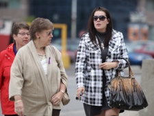 Tara McDonald, right, the mother of slain eight-year-old Woodstock girl Victoria Stafford, and Stafford's grandmother Linda Winters arrive at the courthouse in London, Ont., for the trial of Michael Rafferty, Tuesday, May 1, 2012. (THE CANADIAN PRESS/ Geoff Robins)