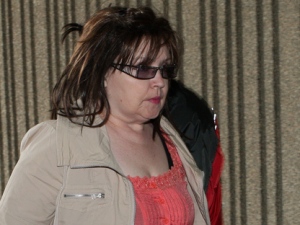 Deborah Murphy, mother of Michael Rafferty, walks into court for proceedings in her son's murder trial in London, Ont., Monday, May 7, 2012. Rafferty has pleaded not guilty to first-degree murder, sexual assault causing bodily harm and kidnapping. (THE CANADIAN PRESS/Dave Chidley)