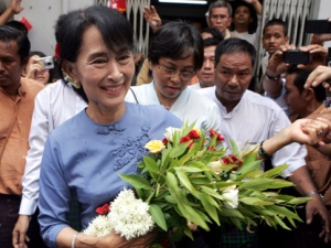 Myanmar opposition leader Aung San Suu Kyi is greeted by supporters as she arrives to attend the opening ceremony of a branch office for her National League for Democracy (NLD) party on Tuesday, May 8, 2012, in Yangon, Myanmar. (AP Photo/Khin Maung Win)