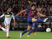 FC Barcelona defender Carles Puyol, right, is chased by Chelsea's Juan Mata during a Champions League second leg semifinal soccer match at the Camp Nou in Barcelona, Spain, Tuesday, April 24, 2012. (AP Photo/Felice Calabro')