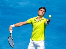 Milos Raonic serves during a Madrid Open tennis tournament match against David Nalbandian in Madrid, Tuesday, May 8, 2012. (AP Photo/Andres Kudacki)