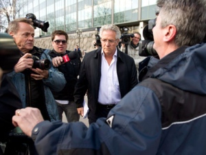 Quebec construction magnate Tony Accurso is surrounded by media as he leaves the Quebec Provincial Police headquarters after being arrested for charges of fraud along with 13 others Tuesday, April 17, 2012 in Montreal. THE CANADIAN PRESS/Paul Chiasson