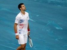 Novak Djokovic from Serbia reacts after losing a point against Serbian Janko Tipsarevic during a Madrid Open tennis tournament match in Madrid, Spain, on Friday, May 11, 2012. (AP Photo/Alberto Di Lolli)