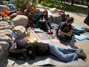 Russian youth opposition protesters rest as they gather at the Chistiye Prudy, or Clean Ponds, where they vowed to continue a roving protest in Moscow, Russia on Friday, May 11, 2012. Some 200 activists have camped out in central Moscow to protest the election of Vladimir Putin and arrests of opposition leaders. (AP Photo/Ivan Sekretarev)