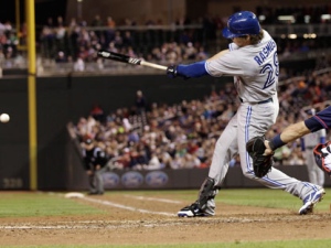 Toronto Blue Jays' Colby Rasmus hits an RBI game-tying single off Minnesota Twins pitcher Nick Blackburn in the fourth inning of a baseball game on Friday, May 11, 2012, in Minneapolis. (AP Photo/Jim Mone)