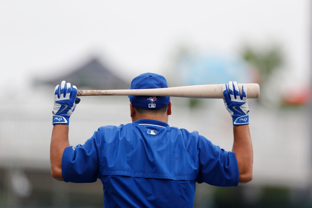 Toronto Blue Jays Paul Molitor, right, is greeted in the dugout as