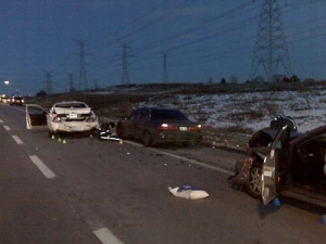 A civillian vehicle appears damaged alongside a police cruiser that was rear-ended.(CP24/Mathew Reid)