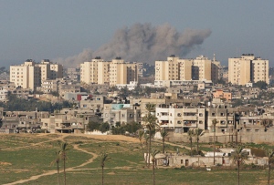 Smoke caused by explosions from Israeli forces' operations rises from buildings in the Gaza Strip, as seen from southern Israel, near Israel's border with the Gaza Strip, Wednesday, Jan. 7, 2009. (AP / Dan Balilty) 