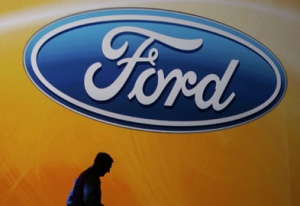 Ford Motor Company CEO and president Alan Mulally walks off the stage after his keynote address at the International Consumer Electronics Show (CES) in Las Vegas, Thursday, Jan. 8, 2009. (AP Photo / Paul Sakuma)