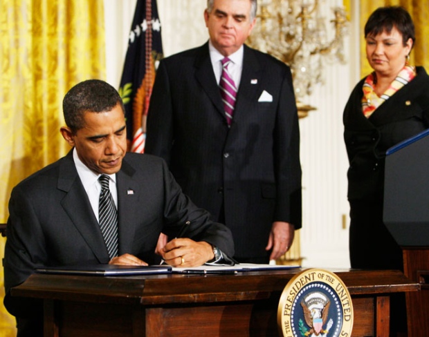 U.S. President Barack Obama signs an executive order after speaking about jobs, energy independence, and climate change, Monday, Jan. 26, 2009. (AP / Charles Dharapak)