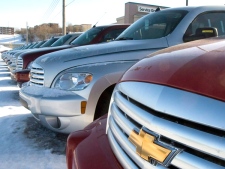 A row of new Chevrolet vehicles are seen at a General Motor dealership in Quebec City on Tuesday, Feb. 17, 2009. (Jacques Boissinot / THE CANADIAN PRESS)