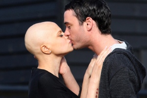 Cancer-stricken reality TV star Jade Goody and her fiance Jack Tweed, right, share a kiss on the driveway of her home in Upshire, England, on Saturday Feb. 21, 2009. (AP / Chris Radburn / PA Wire)