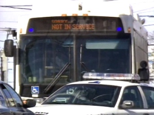 The TTC bus where the shooting occurred was cordoned off by police officers as they collected evidence.