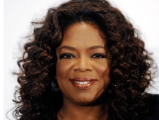 Oprah Winfrey arrives at The Hollywood Reporter's annual Women in Entertainment Breakfast in Beverly Hills, Calif., in this 2008 file photo. (AP / Chris Pizzello)