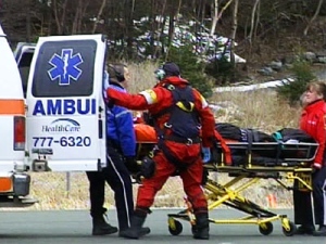 A survivor is transported from a Cougar Helicopter to an ambulance on the helicopter tarmac at the Health Sciences Centre in St. John's, N.L., on Thursday, March 12, 2008.