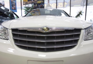 Chrysler products sit in a dealership in Montreal. (CP PHOTO/Ryan Remiorz)