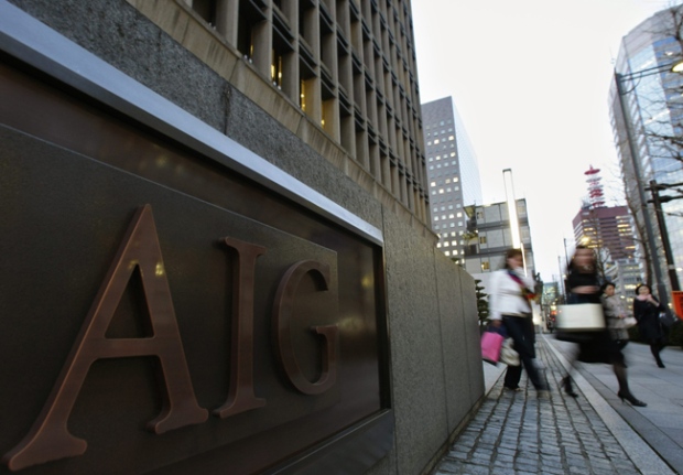 Women walk in front of the AIG building in Tokyo, Japan, Thursday, March 19, 2009. (AP / Shizuo Kambayashi)