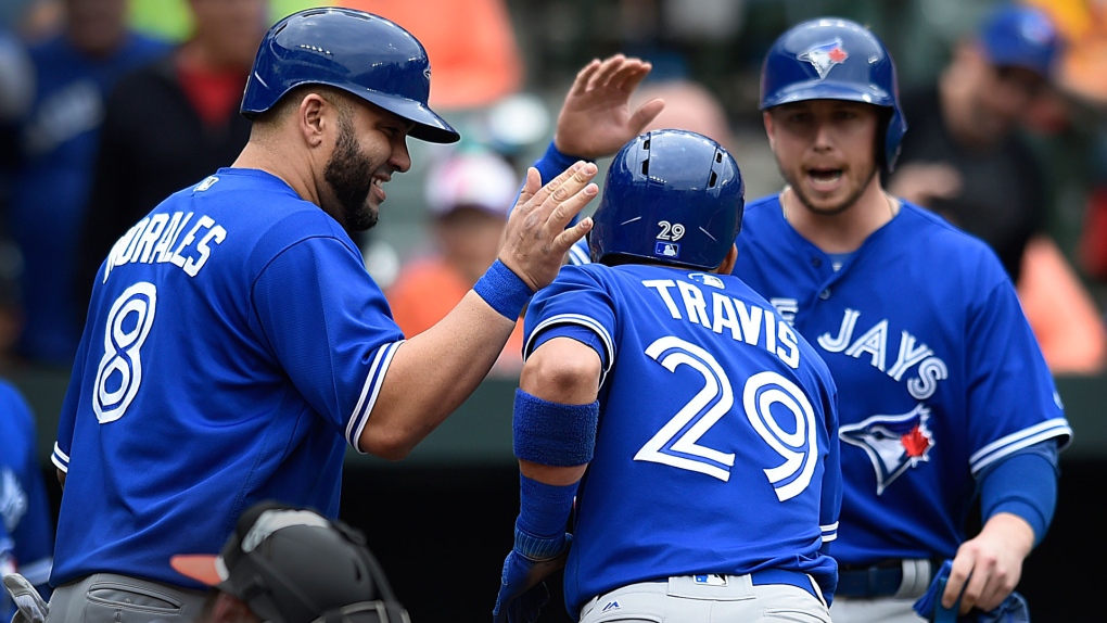 Toronto Blue Jays' Devon Travis hits an RBI single during the