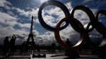 A display of the Olympic rings is set up on Trocadero plaza that overlooks the Eiffel Tower, for the 2024 Games in the French capital, in Paris, France, Thursday, Sept. 14, 2017. Paris will host the 2024 Summer Olympics and Los Angeles will stage the 2028 Games. (AP Photo/Francois Mori)